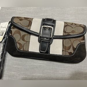 Coach vintage-like clutch w/optional wrist strap. Sale $$ donated to cat shelter